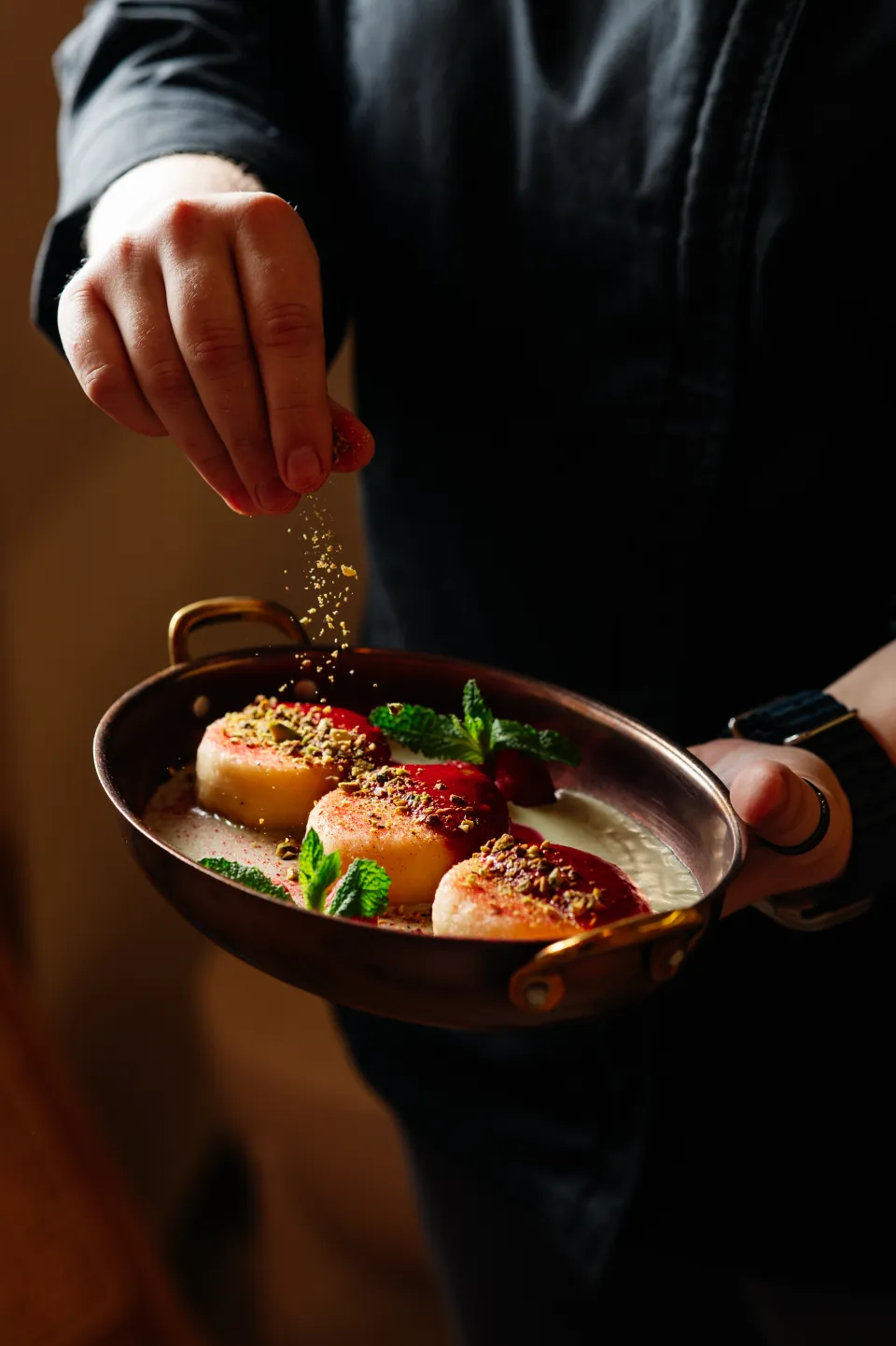A chef finishing Monoblend syrniki