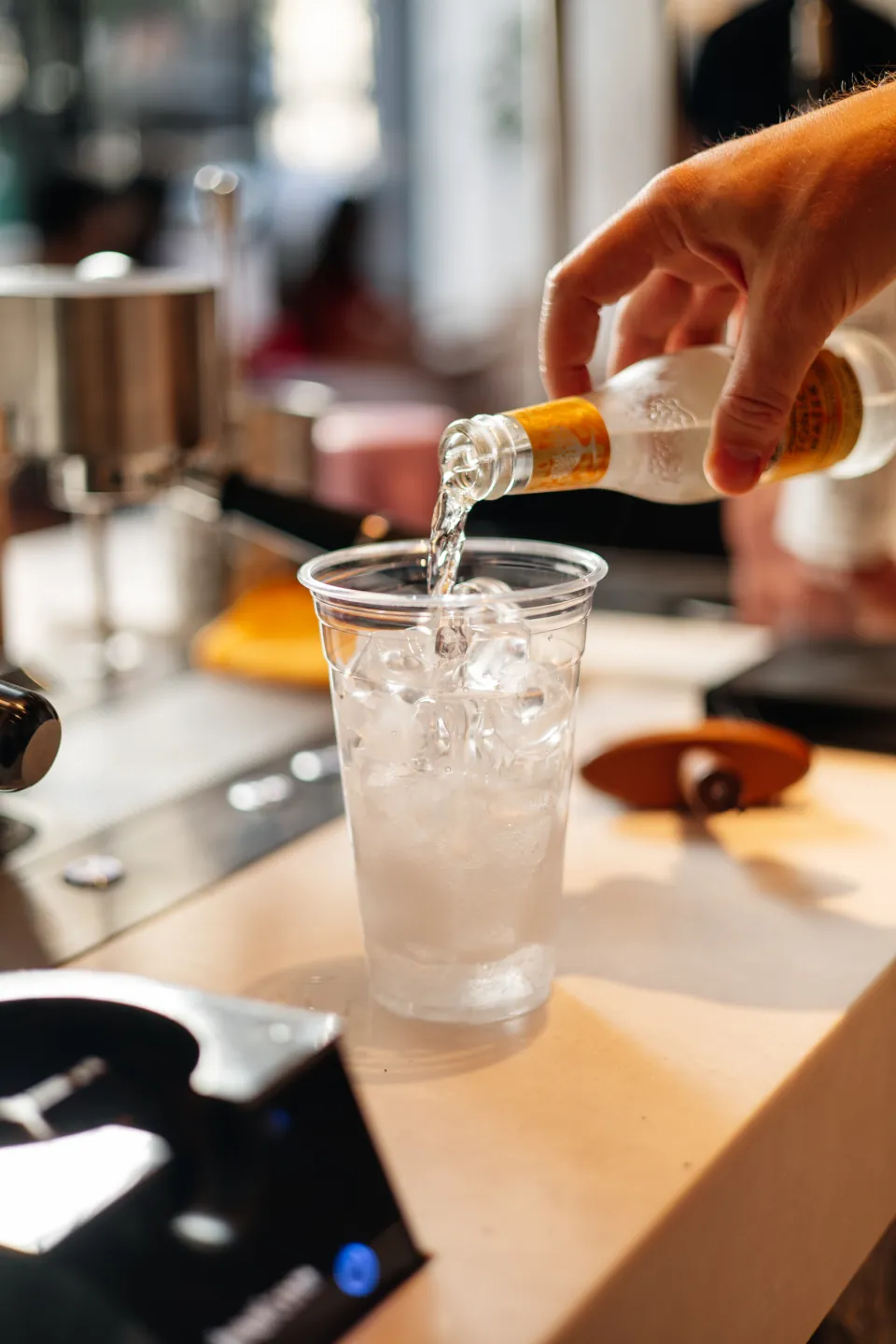A drink being built by hand at the Monoblend bar