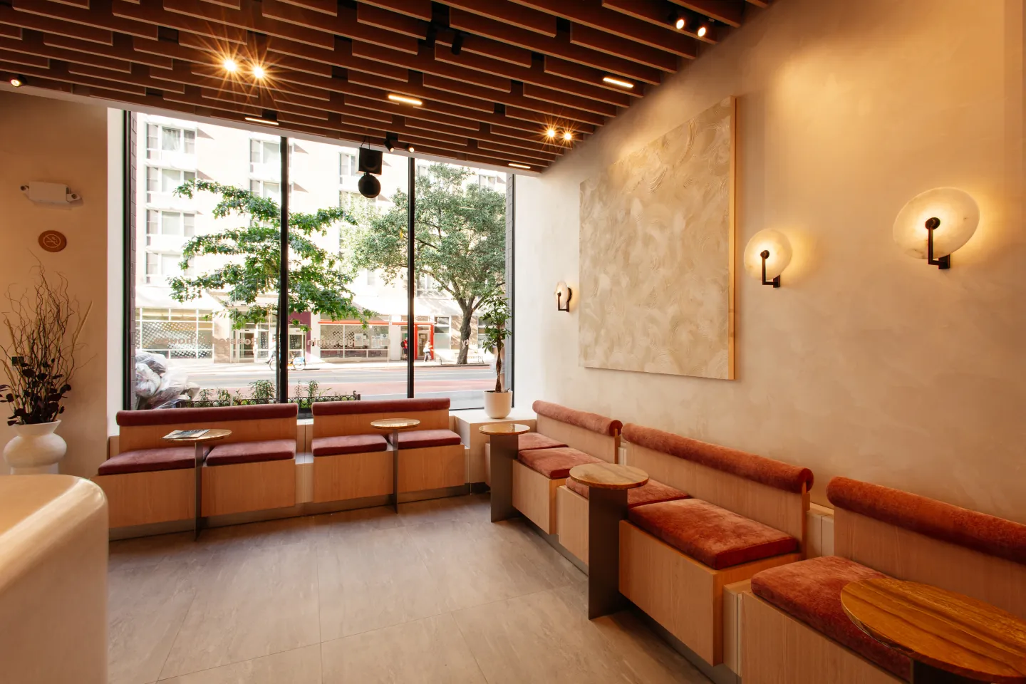 The sunlit Monoblend café interior overlooking West 23rd Street